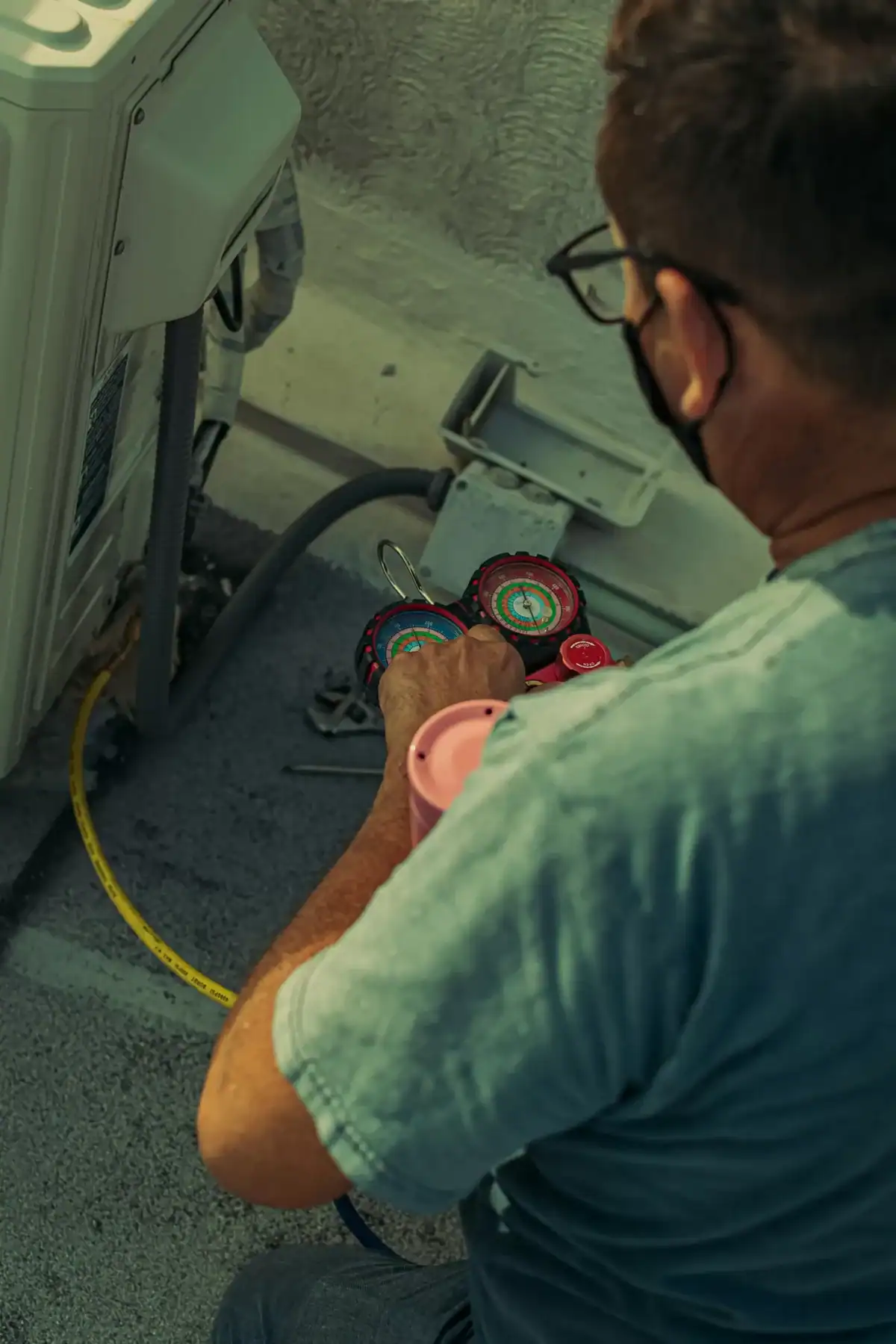Elsmar Air technician servicing a frozen AC unit in Coral Springs