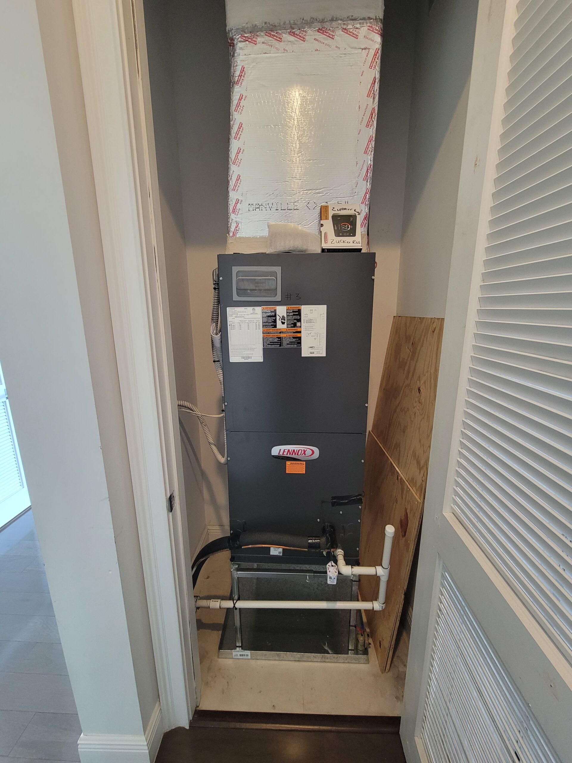 Residential indoor air handler installed in a utility closet