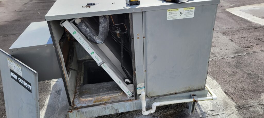 Elsmar Air technician diagnosing an AC not cooling in Coconut Creek