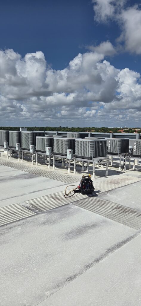 Elsmar Air technician helping a Coral Springs homeowner lower FPL bill costs