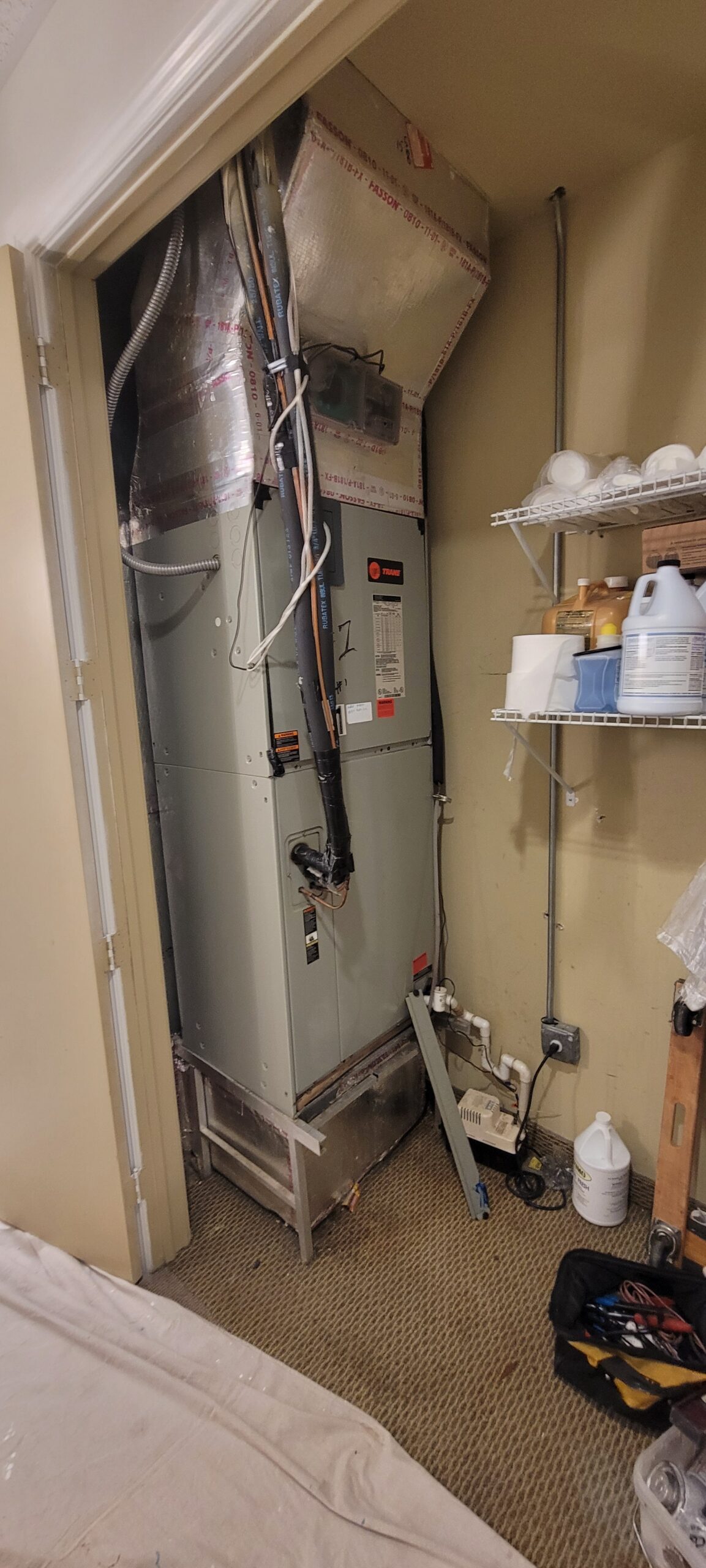 Existing residential indoor air handler in a utility closet