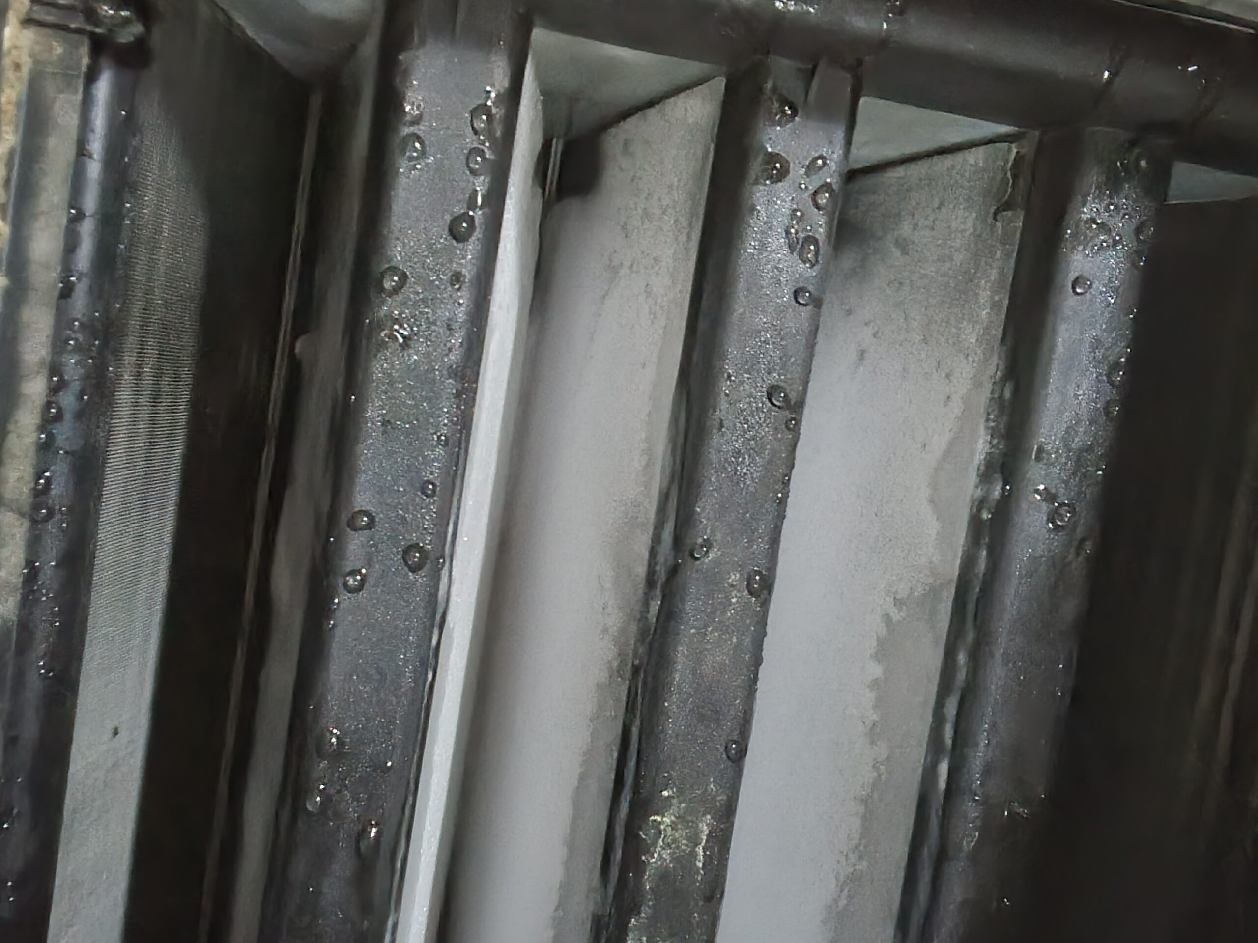 Close-up of an evaporator coil covered in ice